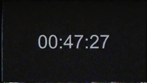 Efeito VHS com timecode. Contagem regressiva de códigos temporais avaria em tempo real um minuto 30 fps. Dígitos sobre fundo preto em tempo real. — Vídeo de Stock