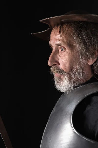 Old bearded man with breastplate and helmet — Stock Photo, Image