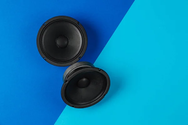 Car audio system. A set of speakers on a blue background.