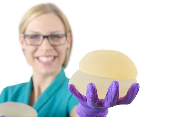 Silicone breast implant. Doctor hold silicone breast prosthesis — Stock Photo, Image