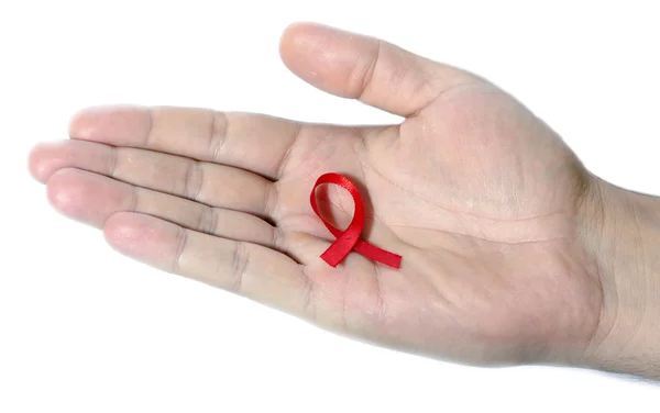 Aids medvetenhet rött band på vit bakgrund. — Stockfoto