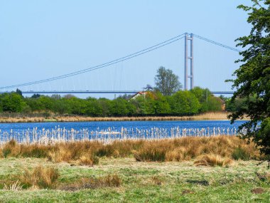 Far Ings Nature Reserve, Lincolnshire, England, with a view of the Humber Bridge clipart