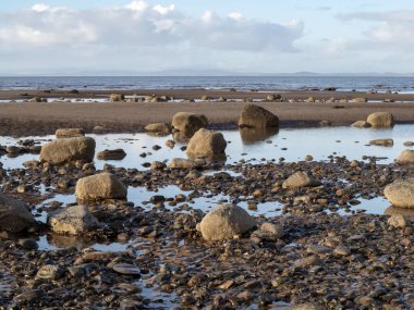 Rocky beach at low tide at Allonby in Cumbria, England