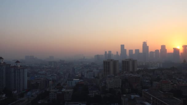 Sunrise time lapse in Guangzhou. There are small and tall houses and cars on the road below. China — Stock Video