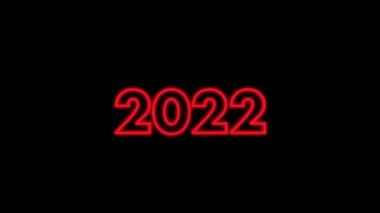 2022 numara, mutlu yıllar. Siyah arkaplanda kırmızı harfler parlıyor