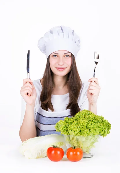 Girl chef going to eat vegetables — Stock Photo, Image