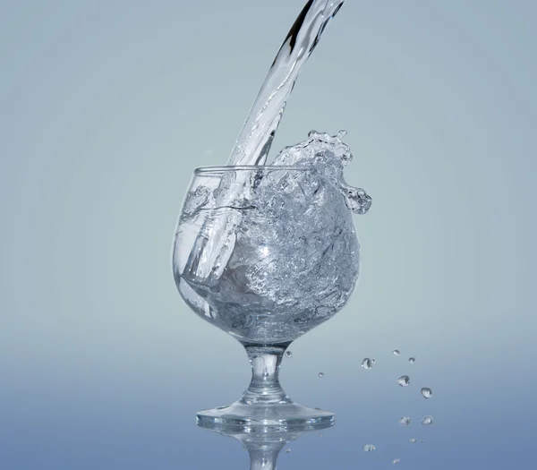 Frozen water splash in a glass — Stock Fotó