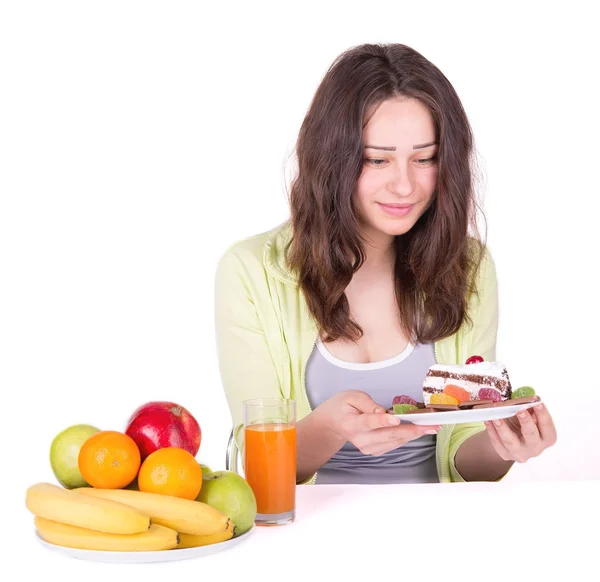 Mädchen auf Diät mit Kuchen in der Hand — Stockfoto