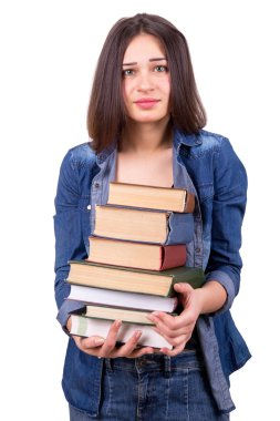 girl holding a large stack of books