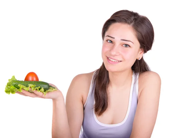 Beautiful girl holding fresh vegetables — Stockfoto