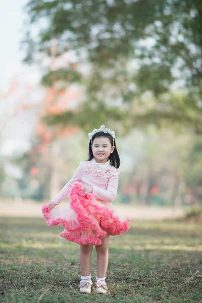 Little asian girl in park — Stock Photo, Image