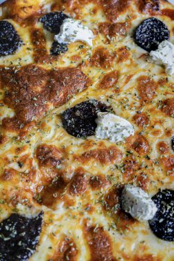 Close up of mozzarella and black sausage pizza. Italian food