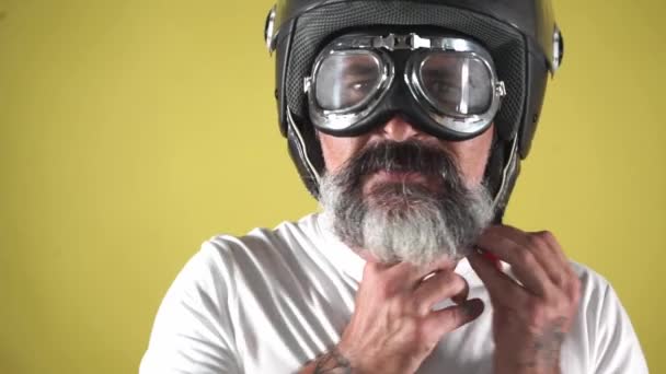 Man Takes Motorcycle Helmet Protector — Stock Video