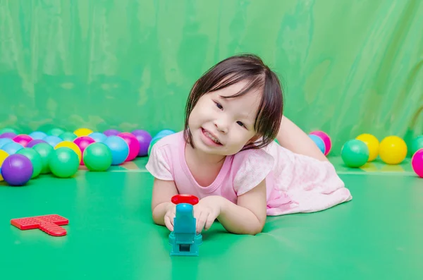 Girl playing toy at school Royalty Free Stock Images