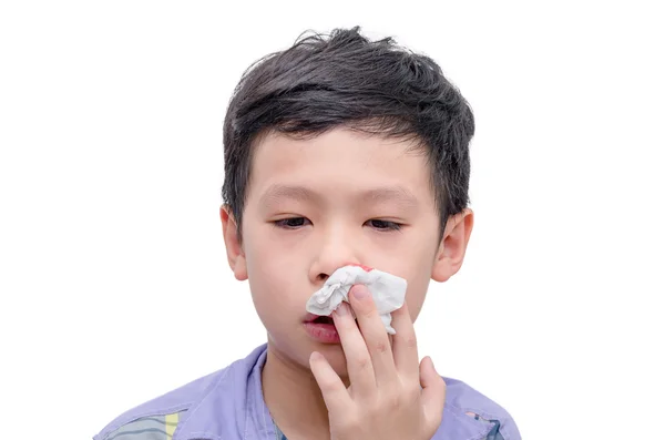 Niño con sangrado de la nariz sobre blanco — Foto de Stock