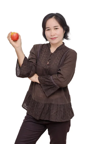 Μέσης ηλικίας γυναίκα που κρατά ένα μήλο — Φωτογραφία Αρχείου
