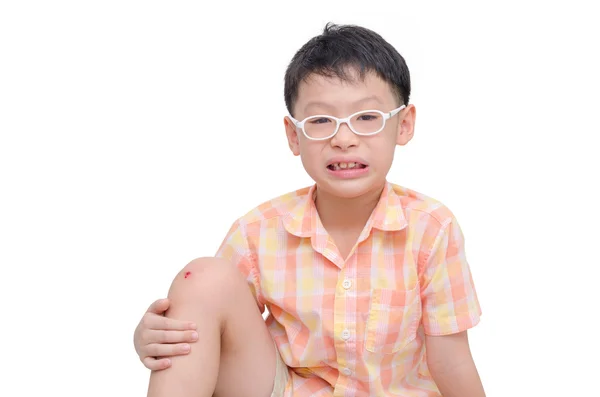 Niño con herida en la rodilla — Foto de Stock