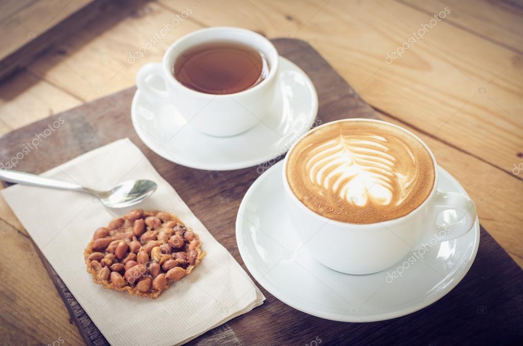 https://st2.depositphotos.com/2889911/11942/i/950/depositphotos_119428860-stock-photo-coffee-cup-and-tea-on.jpg