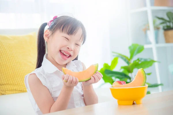 Pretty Little Asian Girl Eating Melon Home Healthy Food Kid — Stock Photo, Image