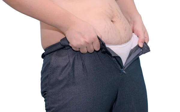 Mujer gorda tratando de usar pantalones — Foto de Stock