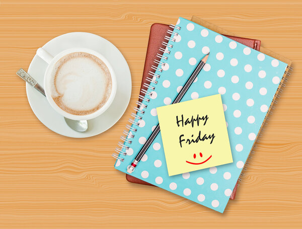 Happy Friday and smile on blank paper with coffee cup