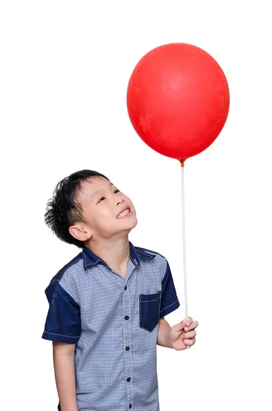 Хлопчик тримає червону кулю — стокове фото