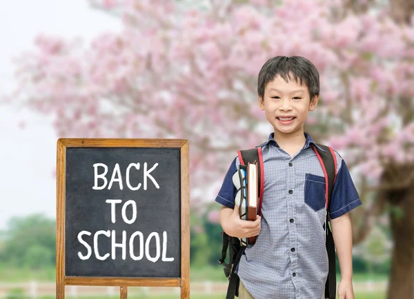 Student with back to school board — Stock Photo, Image