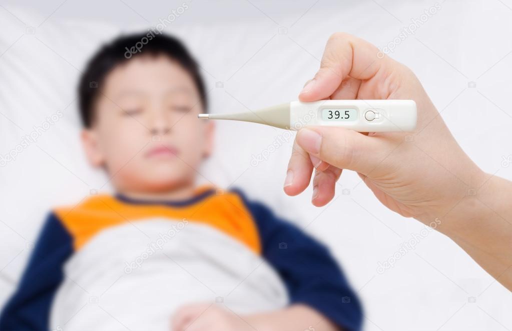 Mother holding digital thermometer