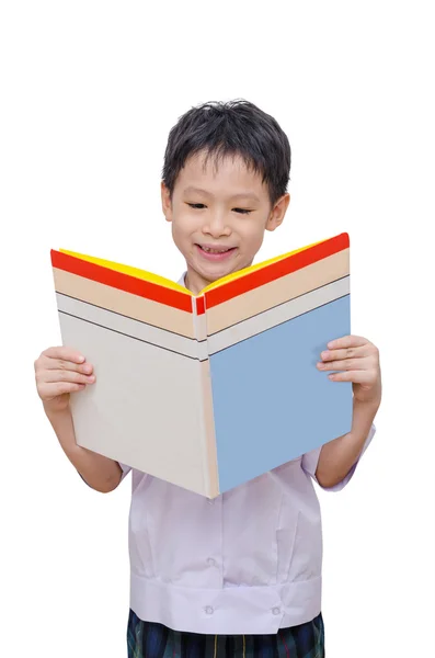 Школьник в униформе читает книги — стоковое фото