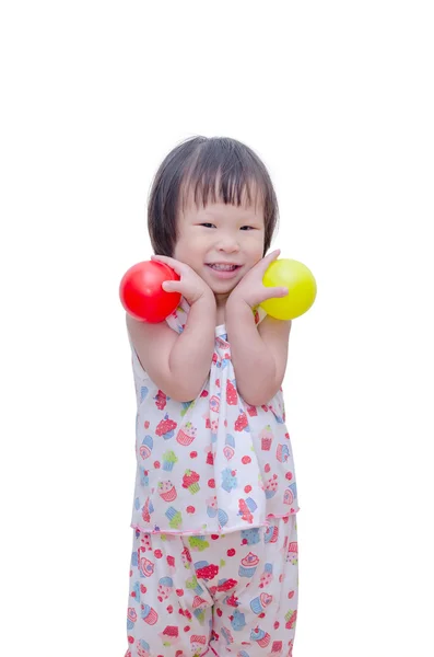 Niña sonriendo con bolas de plástico —  Fotos de Stock