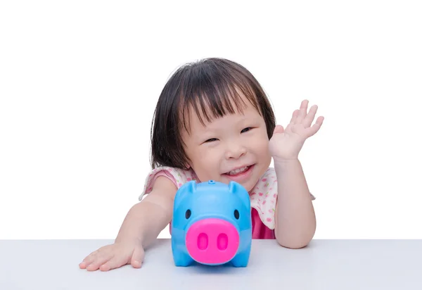 Girl smiling with piggy bank over white — Stock Photo, Image