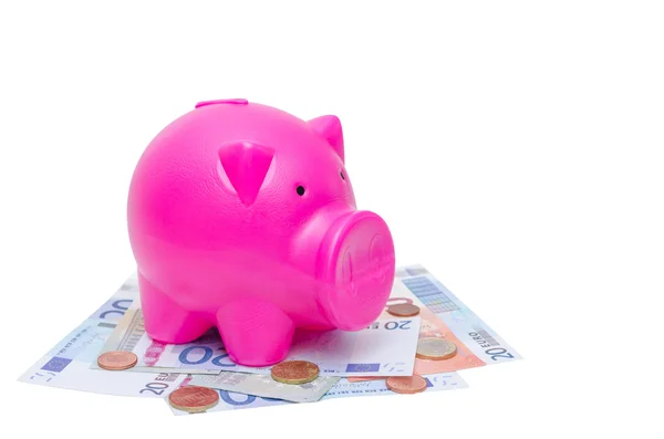 Piggy bank on bank note and coins — Stock Photo, Image