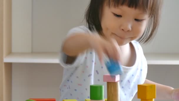 Girl playing with wood blocks — Stock Video