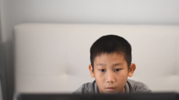 Boy playing game on computer — Stock Video