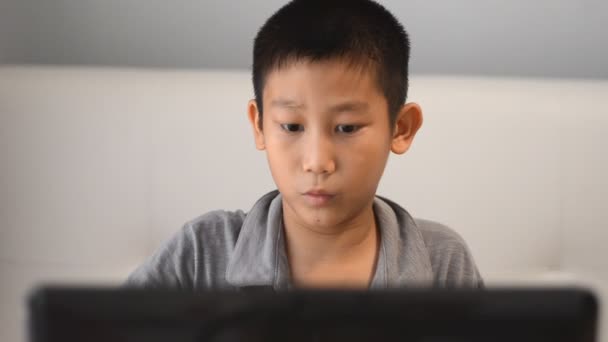 Boy playing game on computer — Stock Video