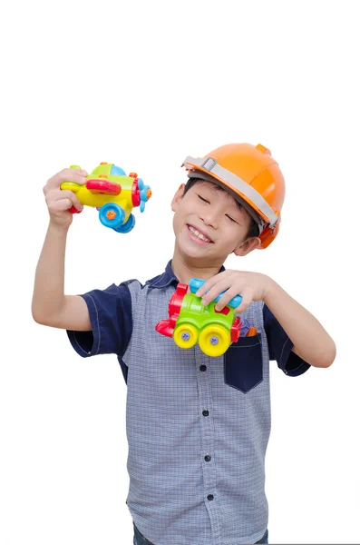 Chlapec hrát s hračkou letadlo a vlak — Stock fotografie