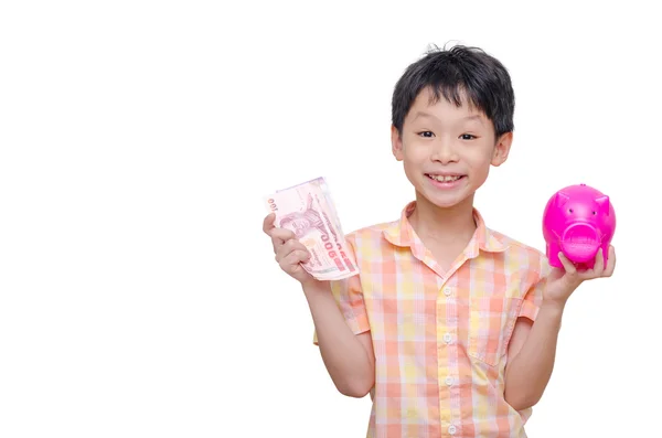 Niño con billete y alcancía —  Fotos de Stock