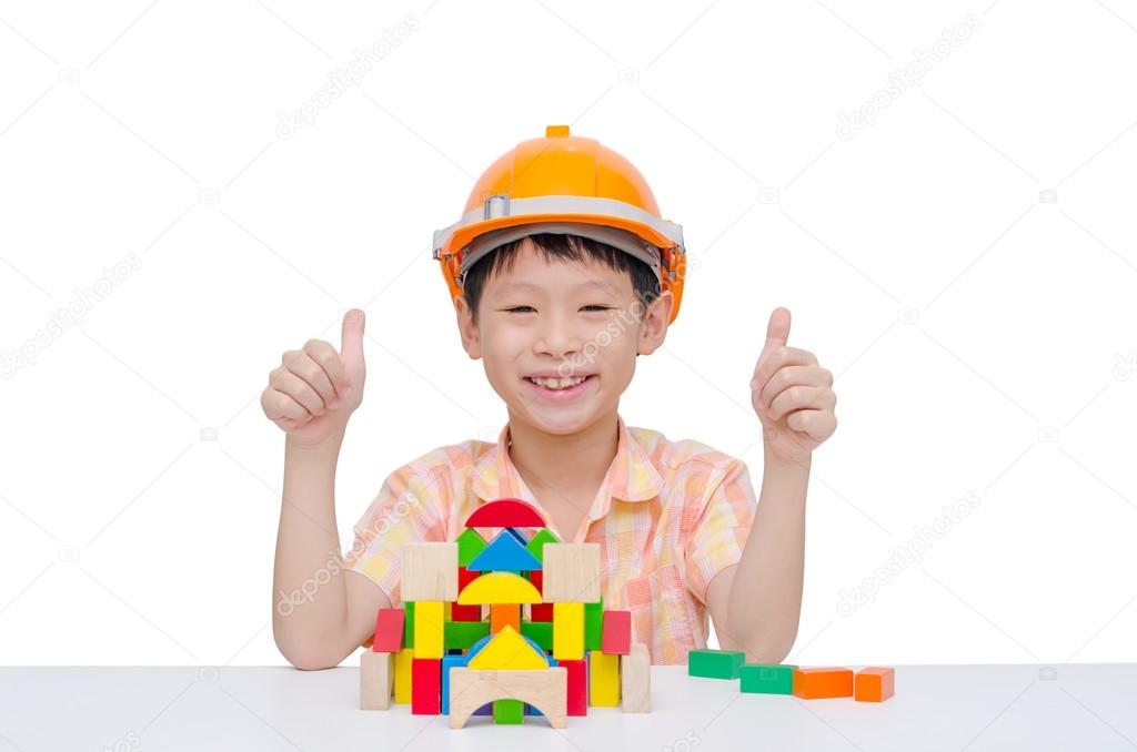 boy playing construction blocks