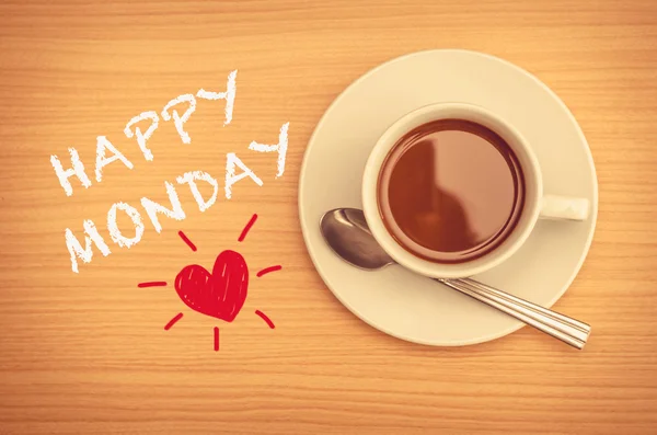 Счастливый понедельник с чашкой кофе на столе — стоковое фото