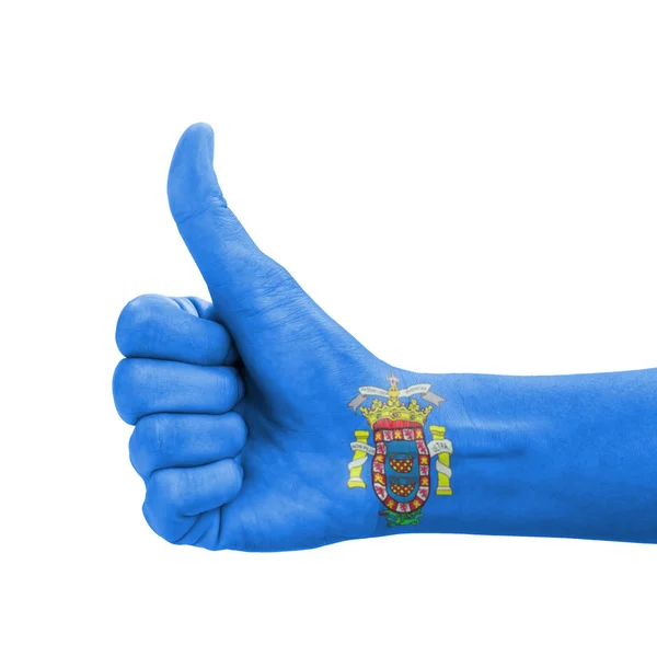 Hand met duim omhoog, Melilla vlag geschilderd als symbool van uitmuntendheid — Stockfoto