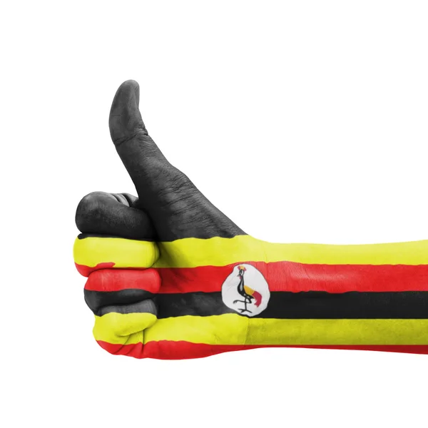 Рукою з пальцем вгору, Уганда прапор розписав як символ досконалості, — стокове фото