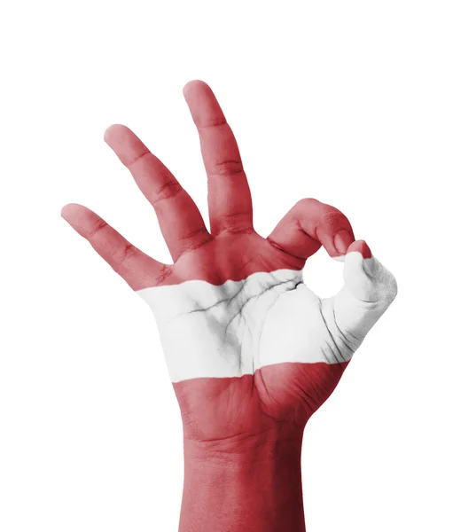 Hand making Ok sign, Latvia flag painted as symbol of best quali — Stock Photo, Image