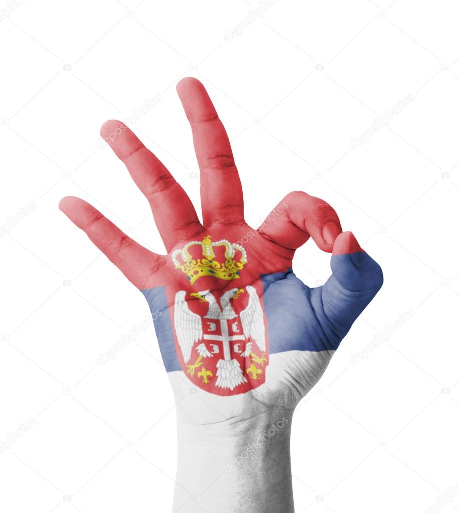 Hand making Ok sign, Serbia flag painted as symbol of best quali