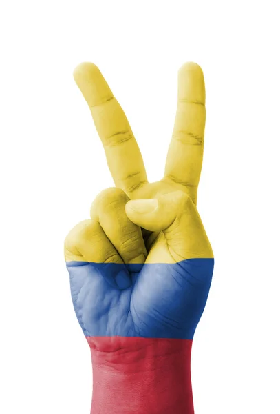 Hand macht das V-Zeichen, kolumbianische Flagge als Symbol des Sieges gemalt — Stockfoto