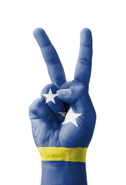 Hand making the V sign, Curacao flag painted as symbol of victor — Stock Photo, Image