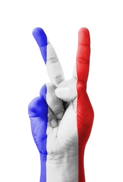 Hand beim Anfertigen des V-Zeichens, Frankreich-Fahne als Siegessymbol bemalt — Stockfoto
