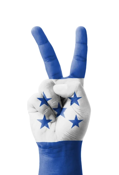 Mano haciendo el signo V, bandera de Honduras pintada como símbolo de victo — Foto de Stock