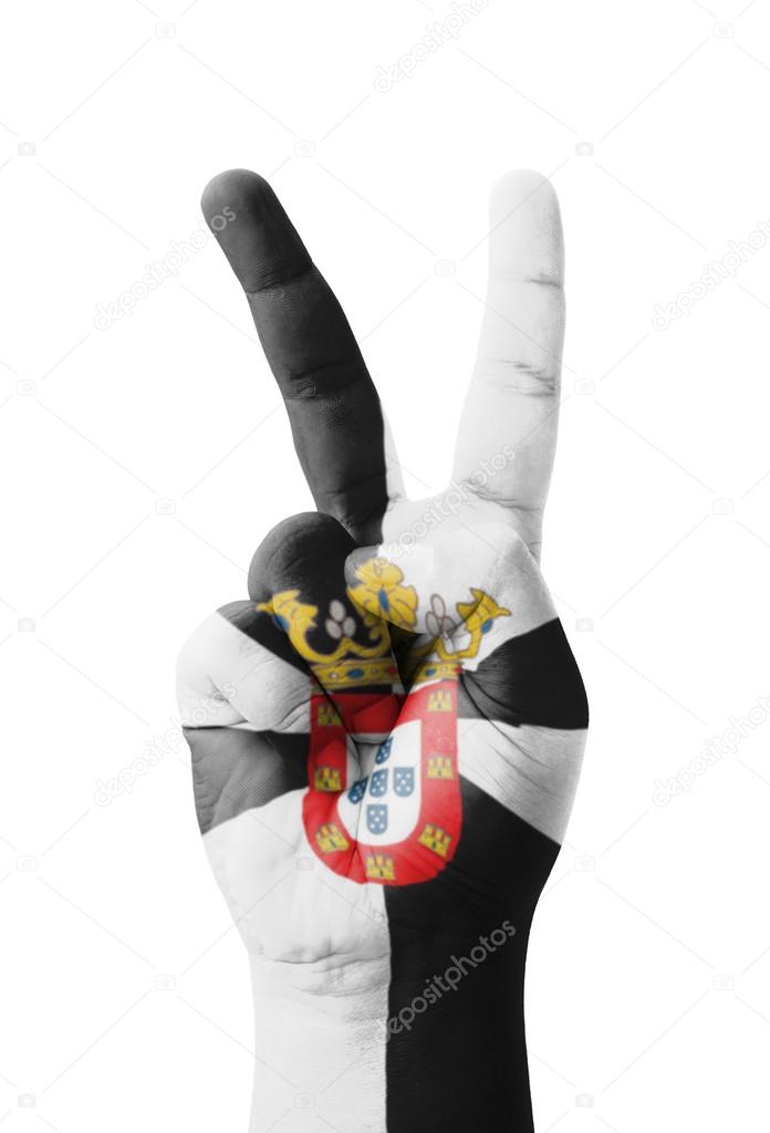 Hand making the V sign, Ceuta flag painted as symbol of victory,