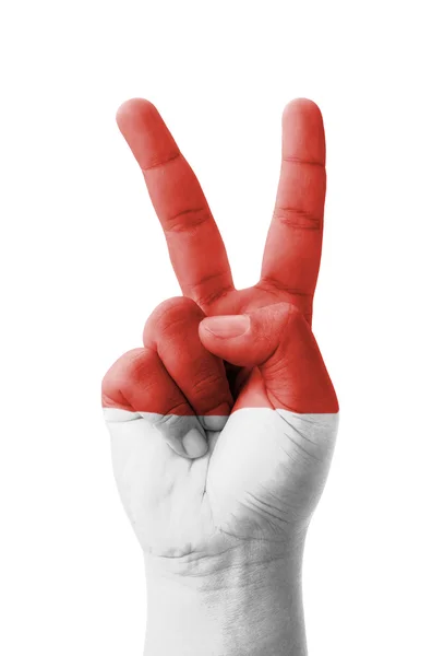 Hand making the V sign, Monaco flag painted as symbol of victory — Stock Photo, Image