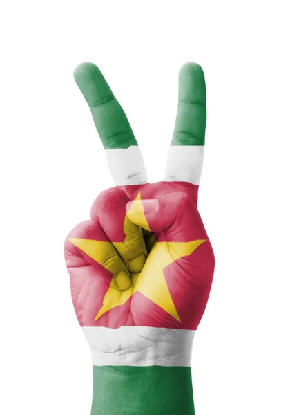 Hand maken het V-teken, Suriname vlag geschilderd als symbool van victo — Stockfoto